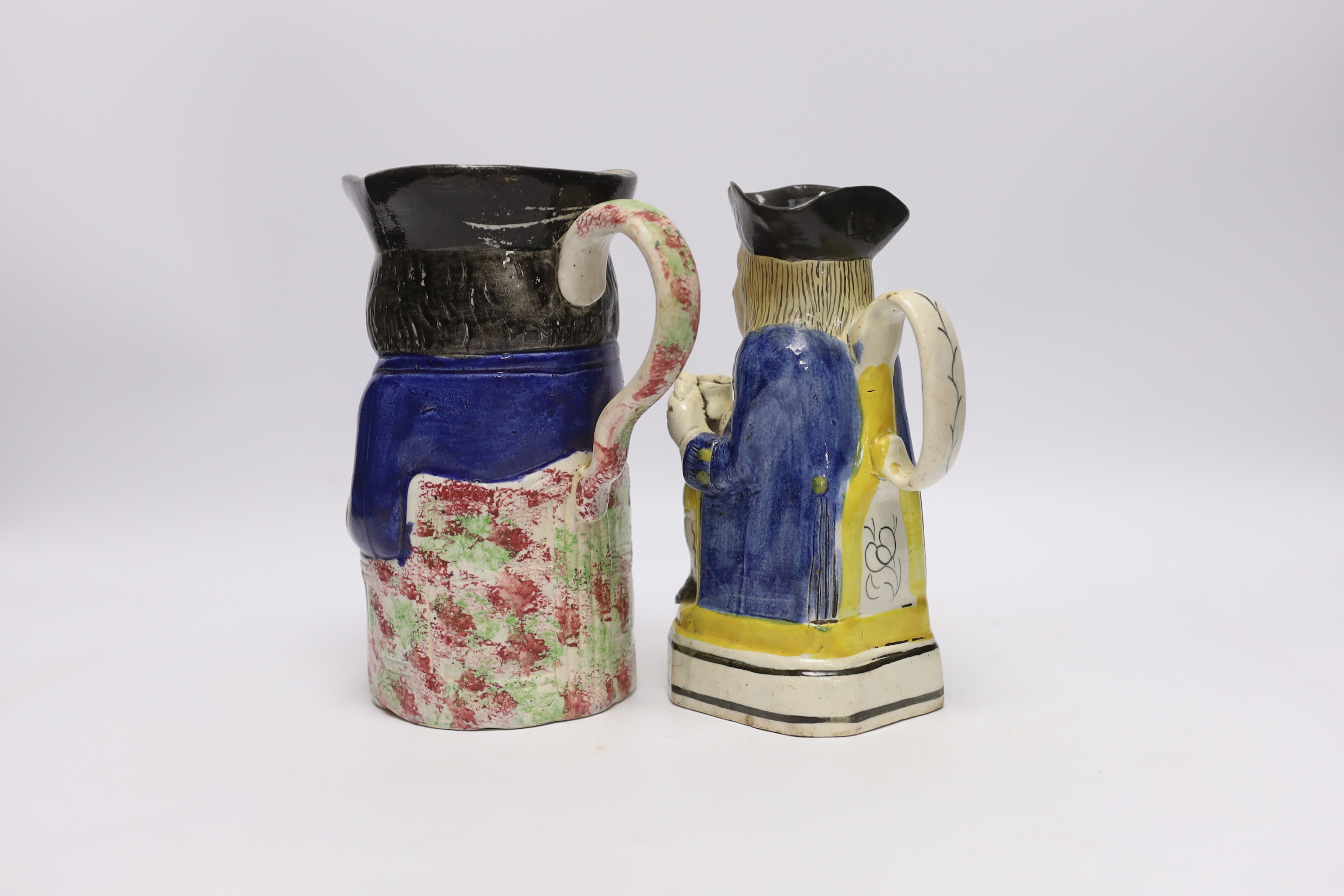 A pearlware Toby jug, c.1795 and late 19th century Staffordshire Toby jug, tallest 19cm